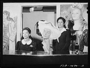 Miss Minnie Coleman (left), clerk, and Miss Selma Barbour (right), manager of the Cecilian Specialty Hat Shop, 454 East 47th Street, Chicago, Illinois