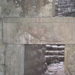 Low door (to slow down attackers) with a lion devouring a bull's head