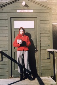 Northwest Airlines stewardess Phyllis Curry in front of the living quarters on Shemya Island, c. 1949