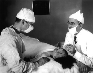 Walter Freeman (right) performing a prefrontal lobotomy with his surgical partner, James Watts